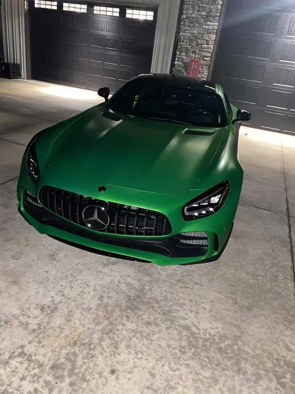 Green classic car parked in a dedicated indoor bay at Gateway Storage