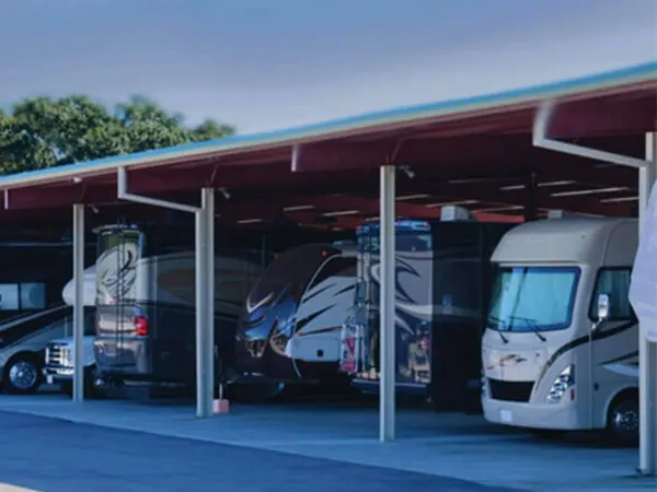 Recreational vehicle parked under the covered carport at Gateway Storage